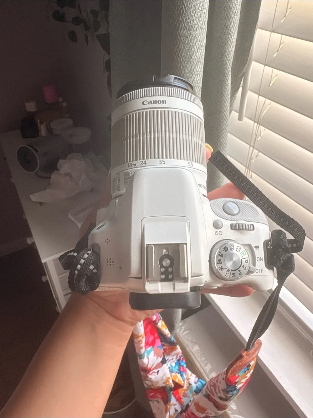 Canon White DSLR Camera with Black Lens Cap